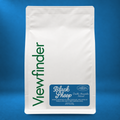 Viewfinder Black Sheep coffee in a white bag on a blue studio background