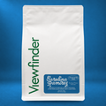 Viewfinder Carolina Ramirez coffee in a white bag on a blue studio background